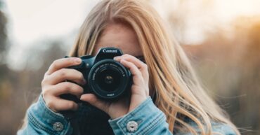 woman taking photo during daytime